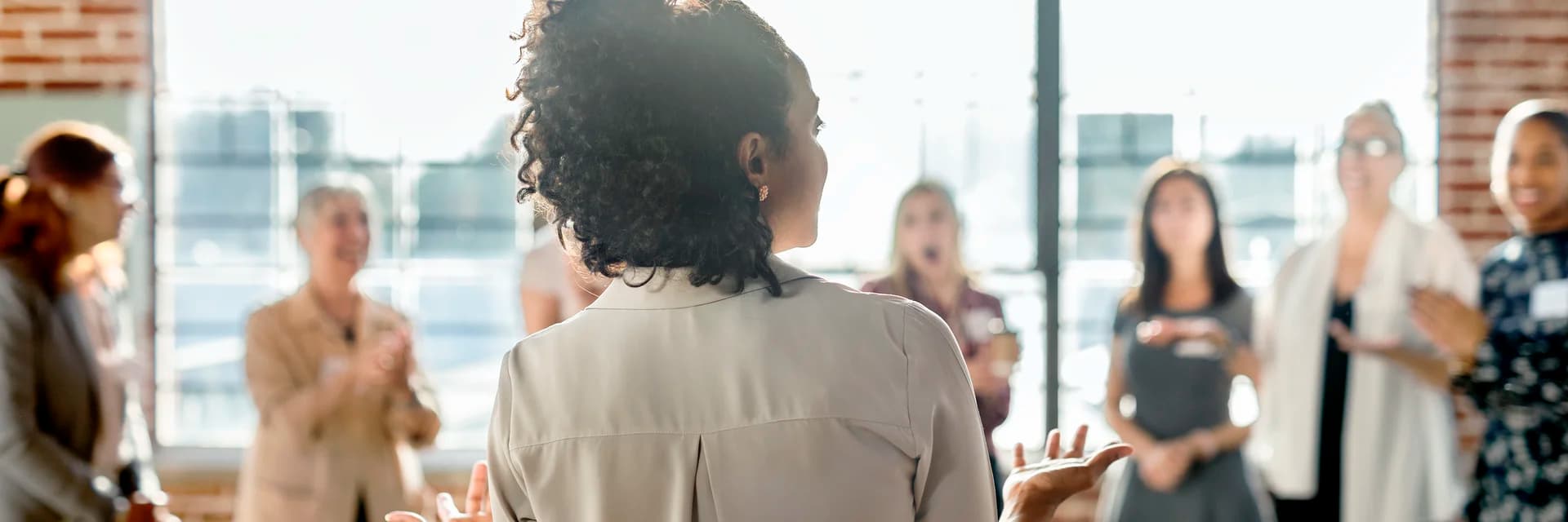 A practitioner leading a group healing event