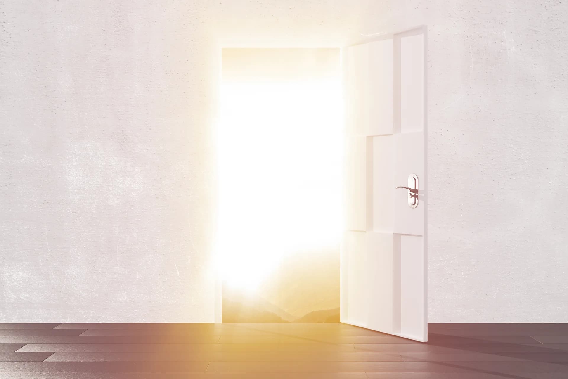 An open doorway glowing with bright golden light at sunset